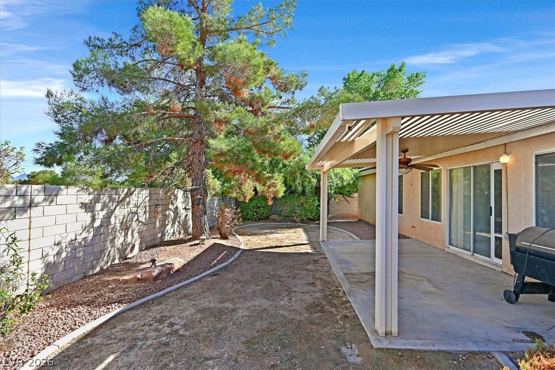 8830 Haviland Road, Las Vegas, NV 89123 An inviting covered patio provides a shaded outdoor space alongside the enclosed backyard.