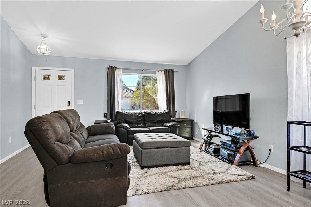 8830 Haviland Road, Las Vegas, NV 89123 Vaulted ceilings and wide-plank flooring define this comfortable living space.