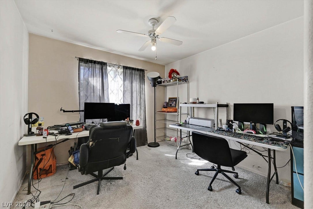 8830 Haviland Road, Las Vegas, NV 89123 A spacious room features plush wall-to-wall carpeting and a wide window.