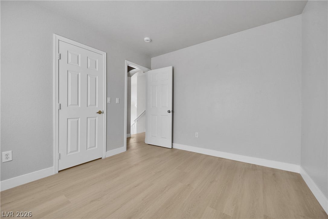 Smooth wood floors and neutral walls define this versatile upstairs room.