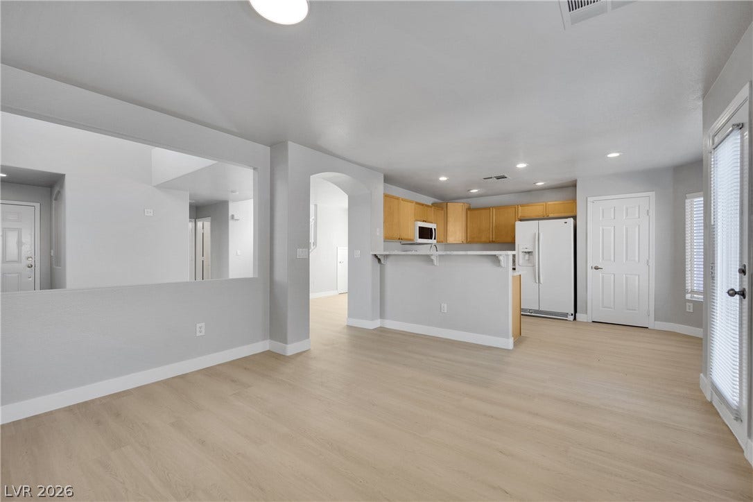 An open layout connects the living space directly to the kitchen.