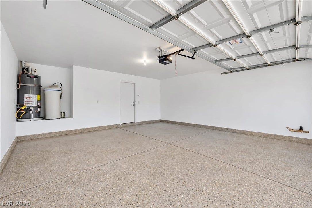 Finished walls and coated flooring elevate this functional multi-car parking space.