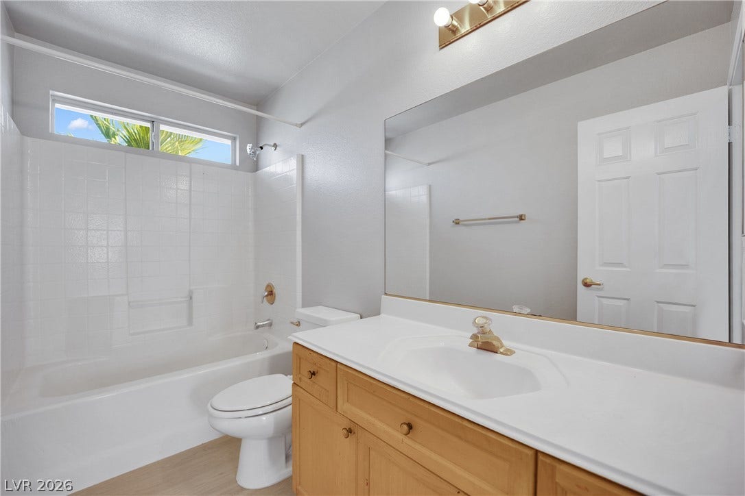Clean lines and a functional vanity maximize space in this classic secondary bathroom.