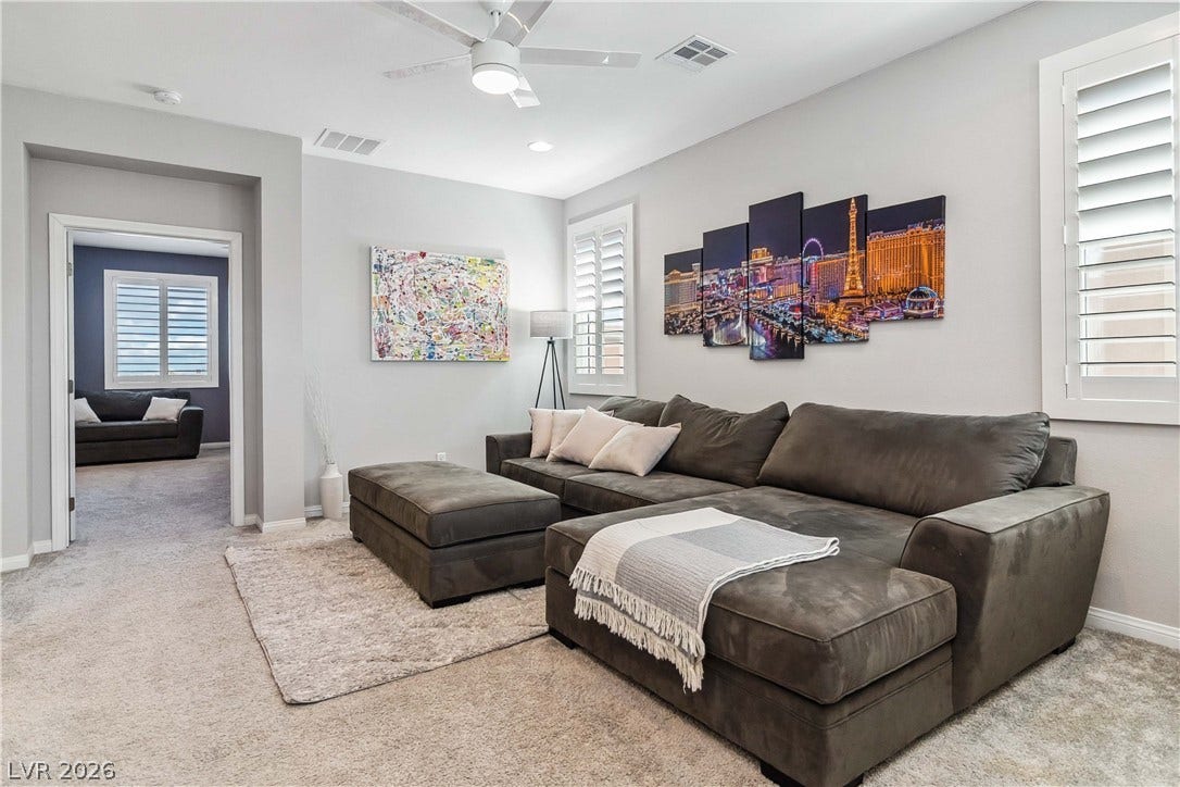 Plush wall-to-wall carpeting and clean architectural lines define this welcoming common area.