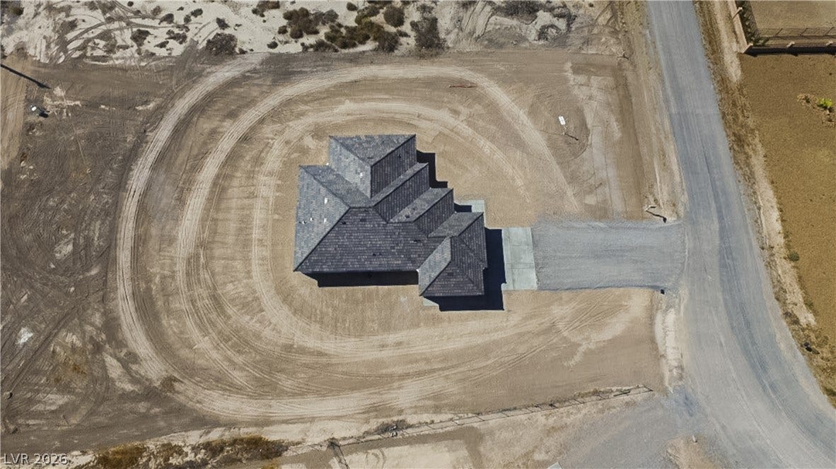 An overhead perspective reveals the unique roofline and expansive footprint of this desert lot.