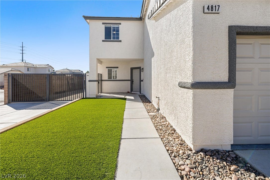 4817 Whispering Spring Avenue, Las Vegas, NV 89131 A neat concrete walkway guides to the entry, bordered by low-maintenance turf and stucco walls.
