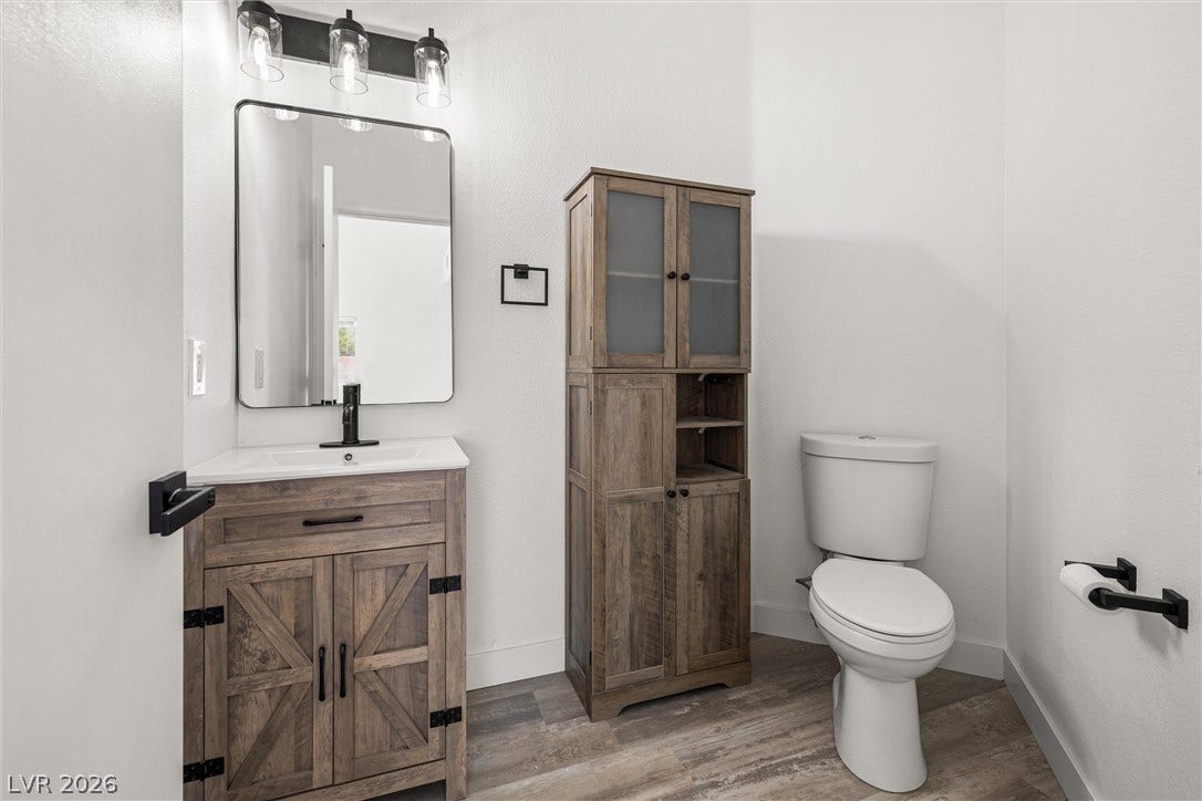 4817 Whispering Spring Avenue, Las Vegas, NV 89131 Modern fixtures and clean lines define this beautifully updated powder room.