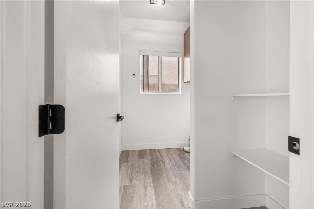 4817 Whispering Spring Avenue, Las Vegas, NV 89131 A view through the doorway reveals a functional space finished with wood-look flooring.