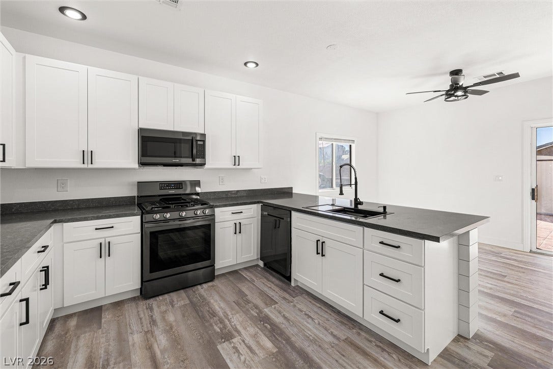 4817 Whispering Spring Avenue, Las Vegas, NV 89131 Clean lines and durable finishes define this contemporary workspace with an expansive prep island.