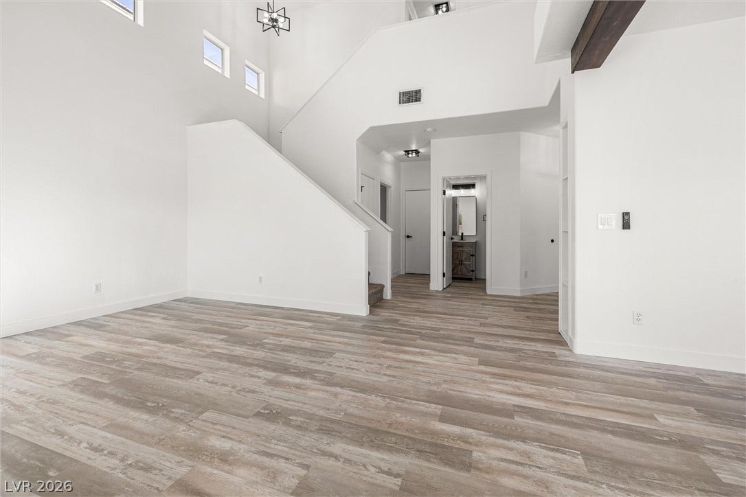 4817 Whispering Spring Avenue, Las Vegas, NV 89131 High ceilings and clean architectural lines define this versatile open living space.