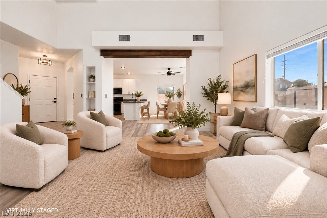 4817 Whispering Spring Avenue, Las Vegas, NV 89131 High ceilings and an open-concept layout define this airy, light-filled living space.