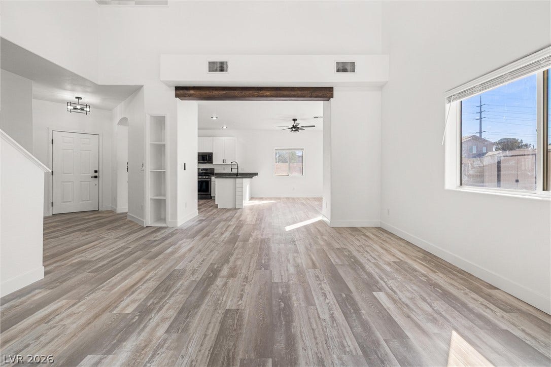4817 Whispering Spring Avenue, Las Vegas, NV 89131 Clean lines and wood-look flooring define this light-filled, open-concept living space.