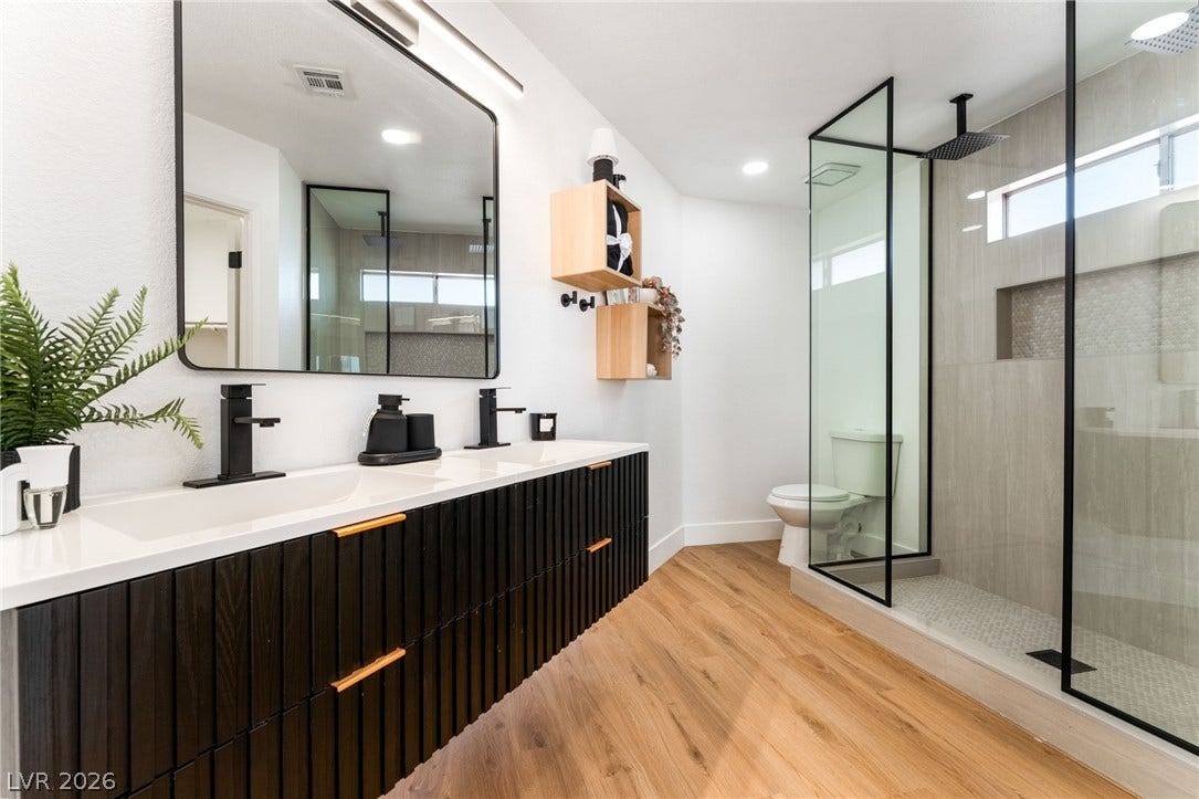 Clean lines and a modern walk-in shower define this contemporary bathroom.