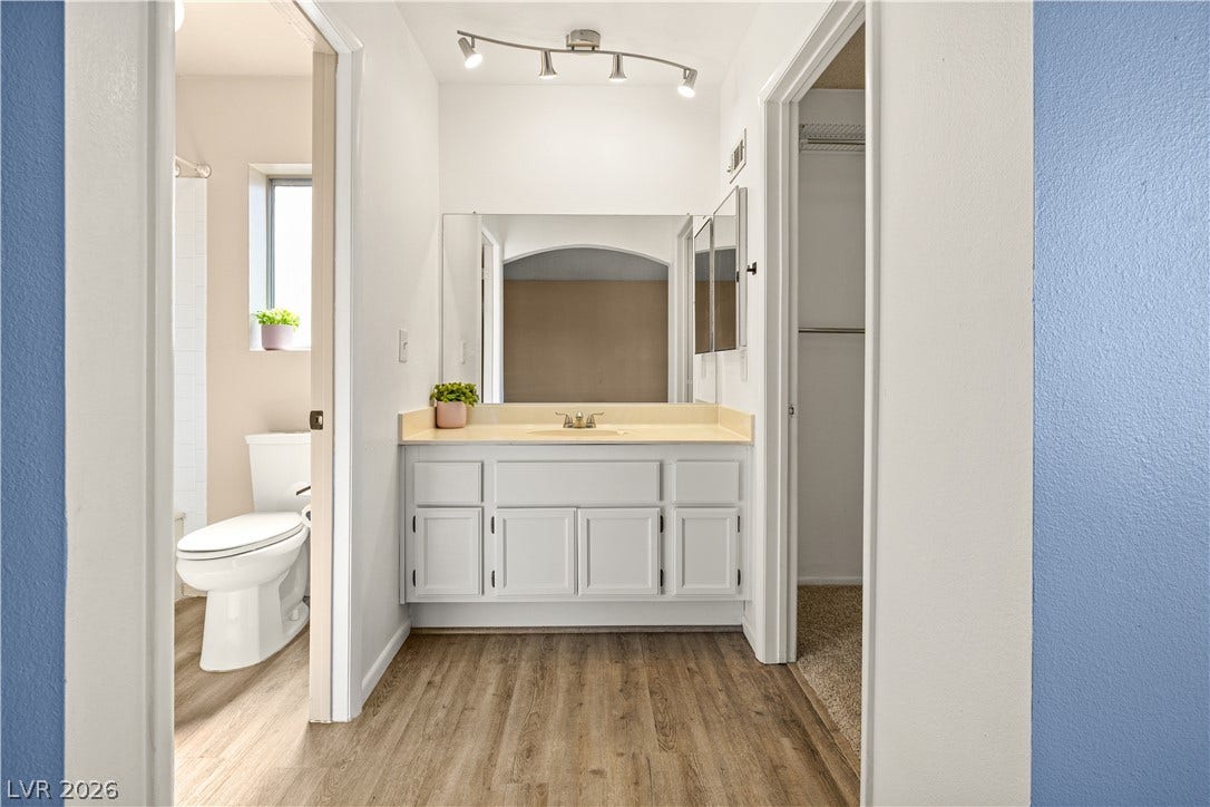 325 Manor Street, Las Vegas, NV 89145 A well-designed vanity area connects seamlessly to adjacent spaces through wide doorways.