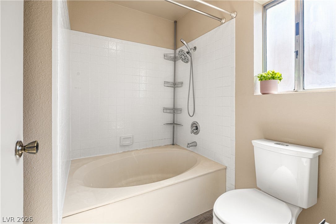 325 Manor Street, Las Vegas, NV 89145 An inviting soaking tub serves as the centerpiece of this bath space.