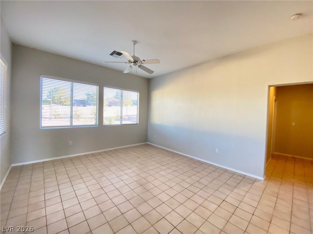 Tiled flooring and large windows bring a clean, open feel to this versatile living space.