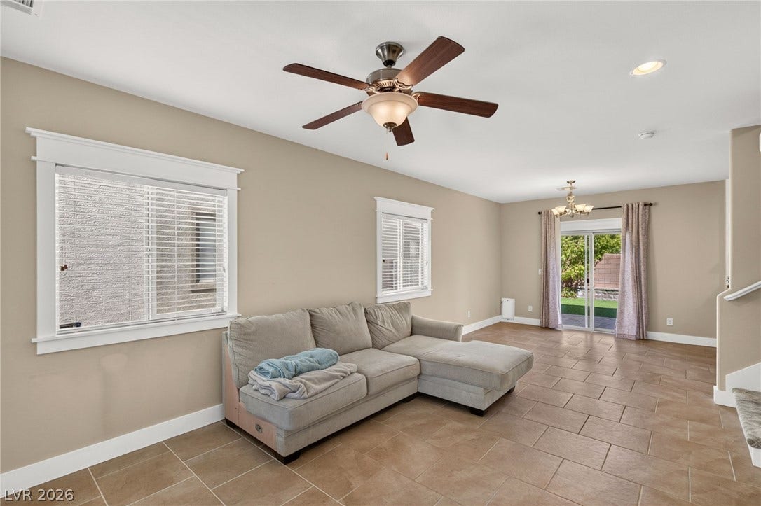 8112 Winterfell Place, Las Vegas, NV 89166 An open floorplan connects this versatile living area directly to the rear patio exit.