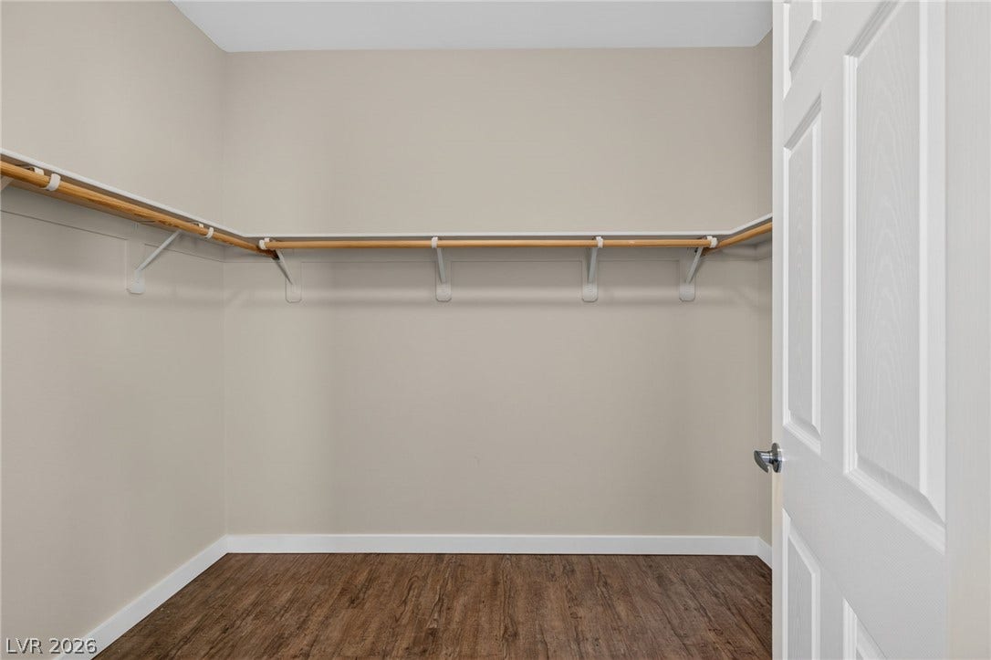 8112 Winterfell Place, Las Vegas, NV 89166 A spacious walk-in closet includes built-in wrap-around shelving over durable wood-look flooring.