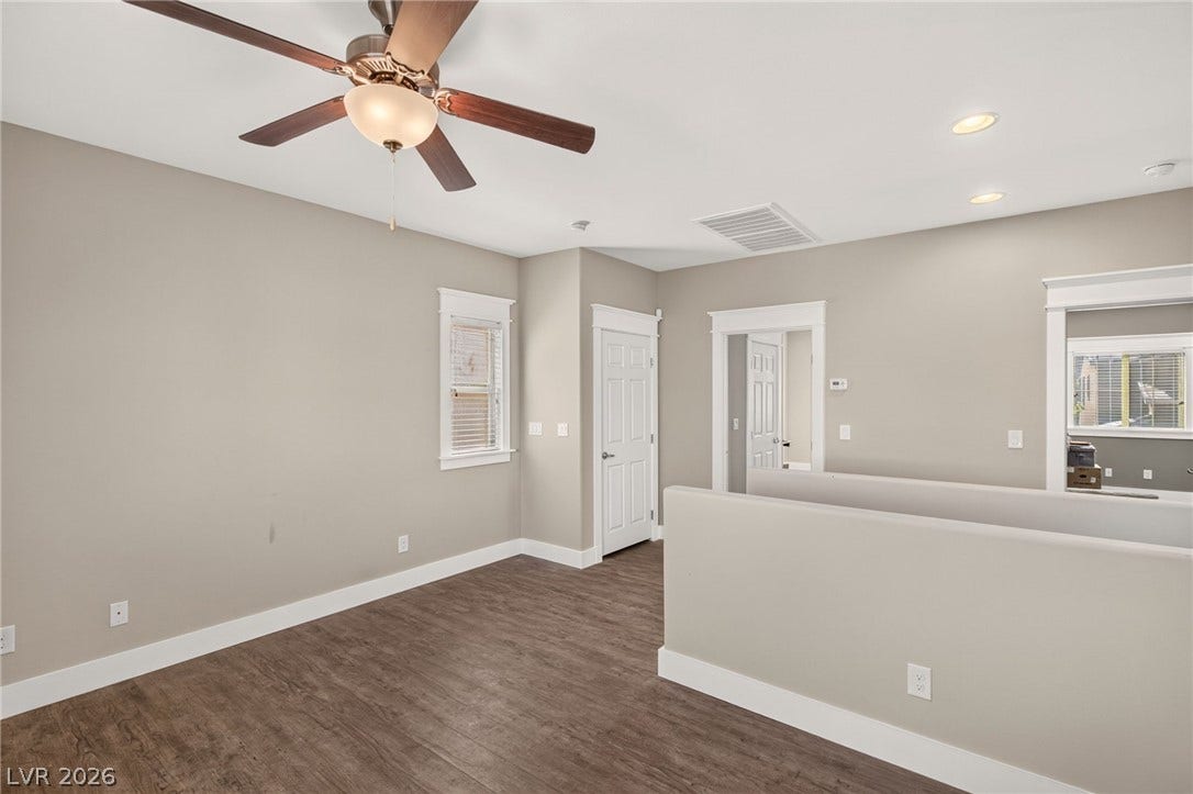 8112 Winterfell Place, Las Vegas, NV 89166 Gleaming wood-look floors complement the clean lines of this versatile upper-level landing space.
