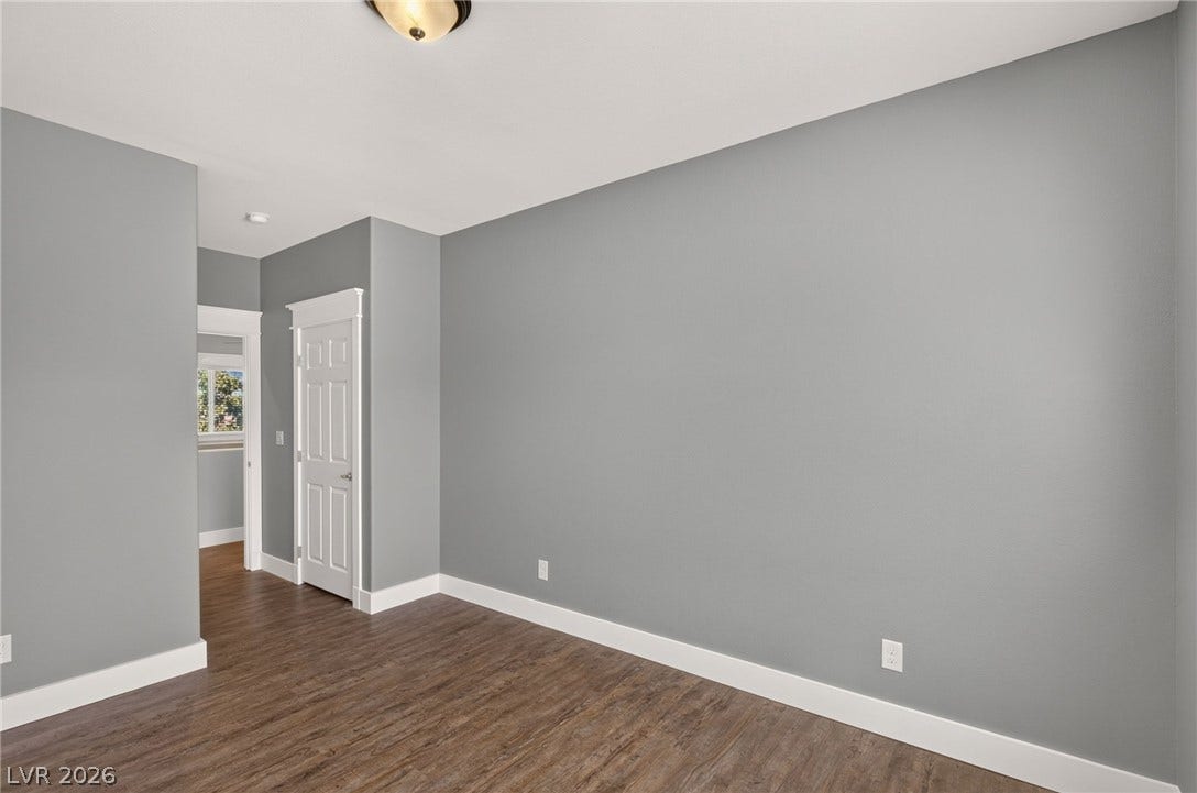 8112 Winterfell Place, Las Vegas, NV 89166 Rich wood-look flooring and clean white trim define this versatile interior space.