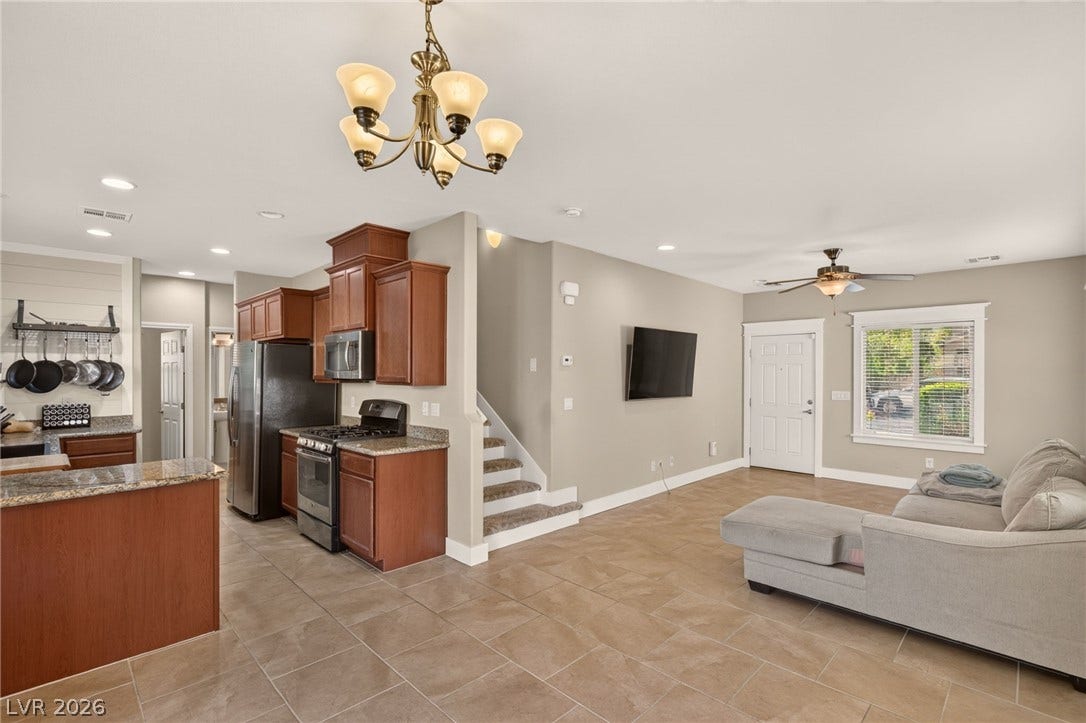 8112 Winterfell Place, Las Vegas, NV 89166 An open-concept living area flows seamlessly into the kitchen over durable tile flooring.