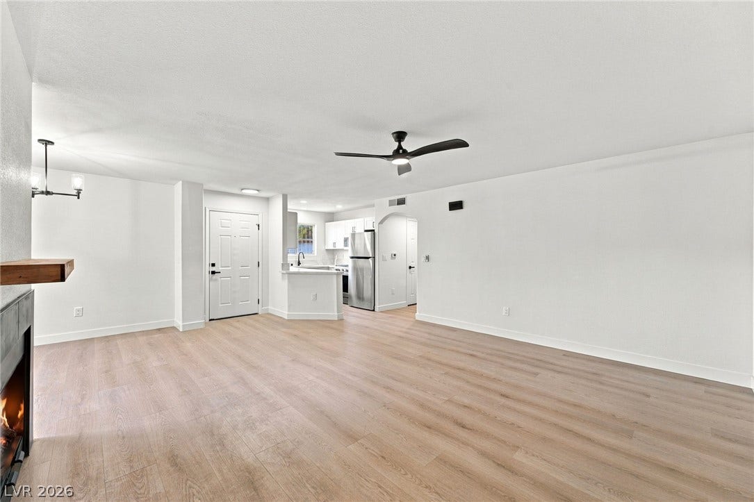 4500 W Lake Mead Boulevard, #102, Las Vegas, NV 89108 An open floor plan seamlessly connects the main living space to the adjacent kitchen.