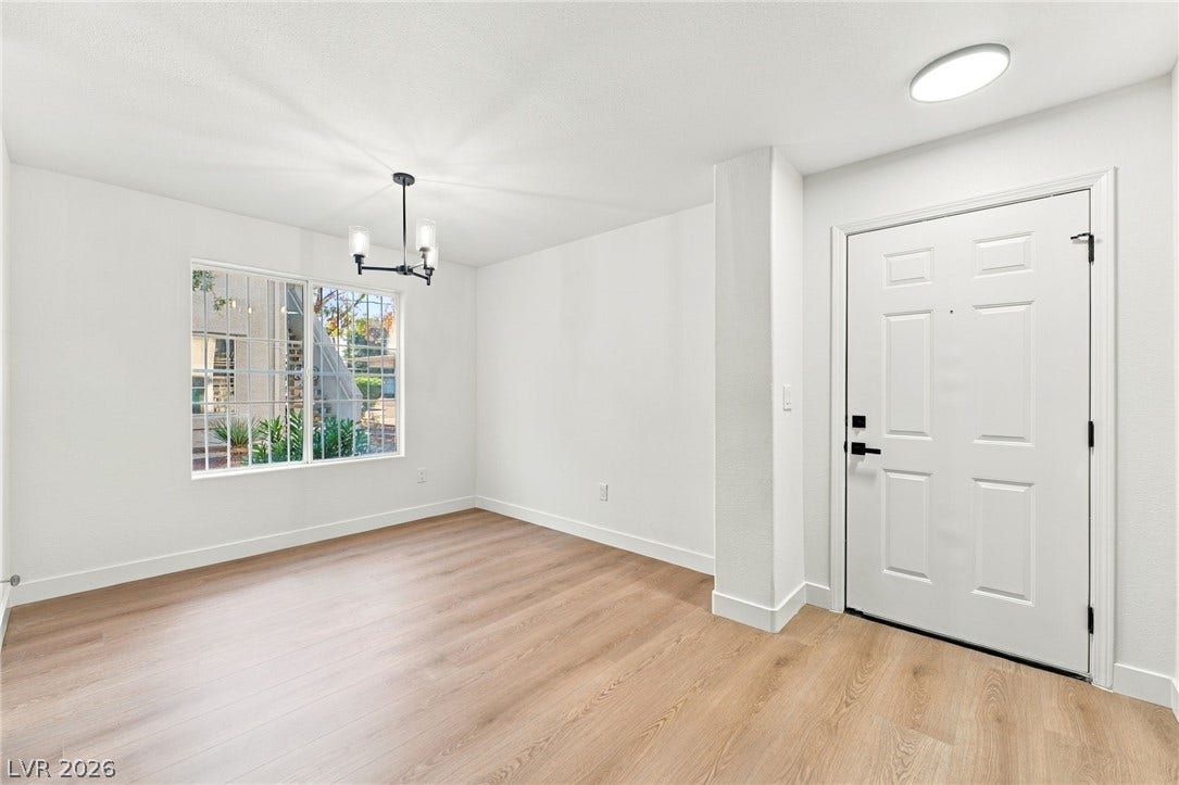 4500 W Lake Mead Boulevard, #102, Las Vegas, NV 89108 Gleaming wood floors and crisp white walls frame this inviting entryway.