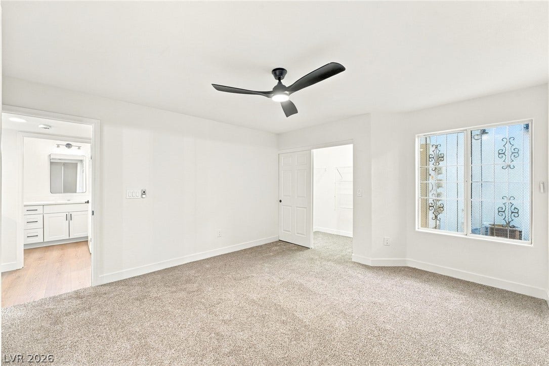 4500 W Lake Mead Boulevard, #102, Las Vegas, NV 89108 Soft carpeting underfoot anchors this quiet space connected directly to an ensuite bath.