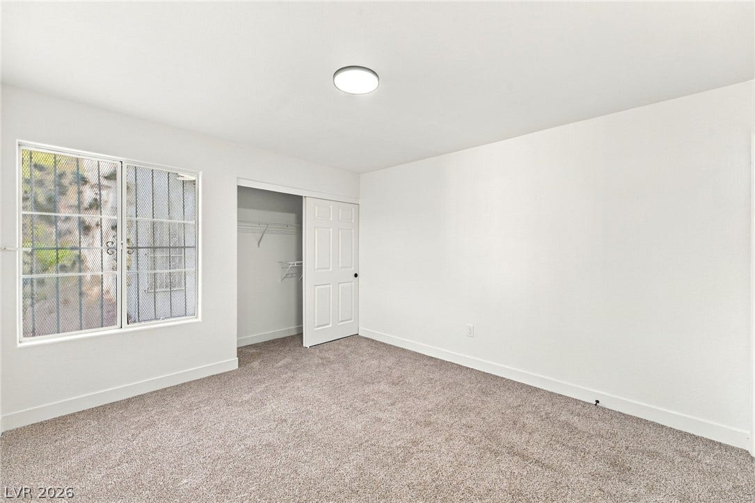 4500 W Lake Mead Boulevard, #102, Las Vegas, NV 89108 A spacious bedroom offers plush neutral carpeting and a convenient closet.