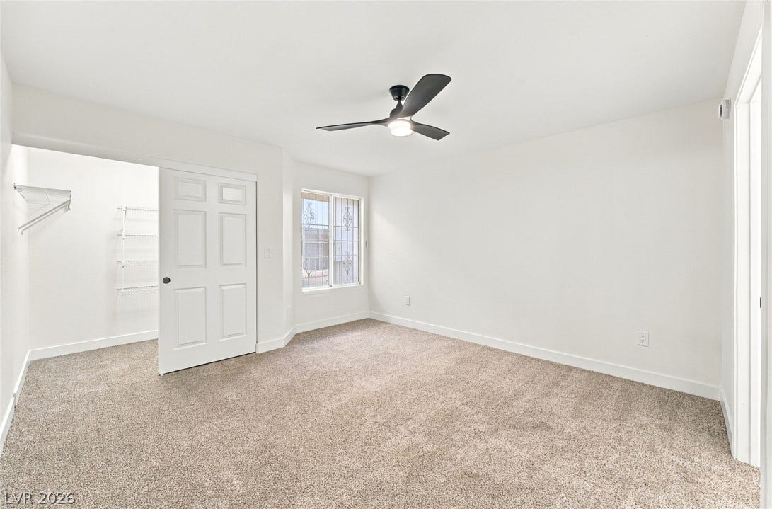 4500 W Lake Mead Boulevard, #102, Las Vegas, NV 89108 Plush carpeting underfoot and a walk-in closet highlight this comfortable bedroom space.