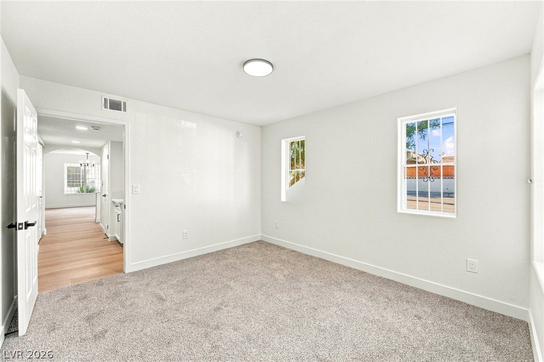 4500 W Lake Mead Boulevard, #102, Las Vegas, NV 89108 Plush carpeting and dual windows create a comfortable ambiance in this versatile bedroom space.