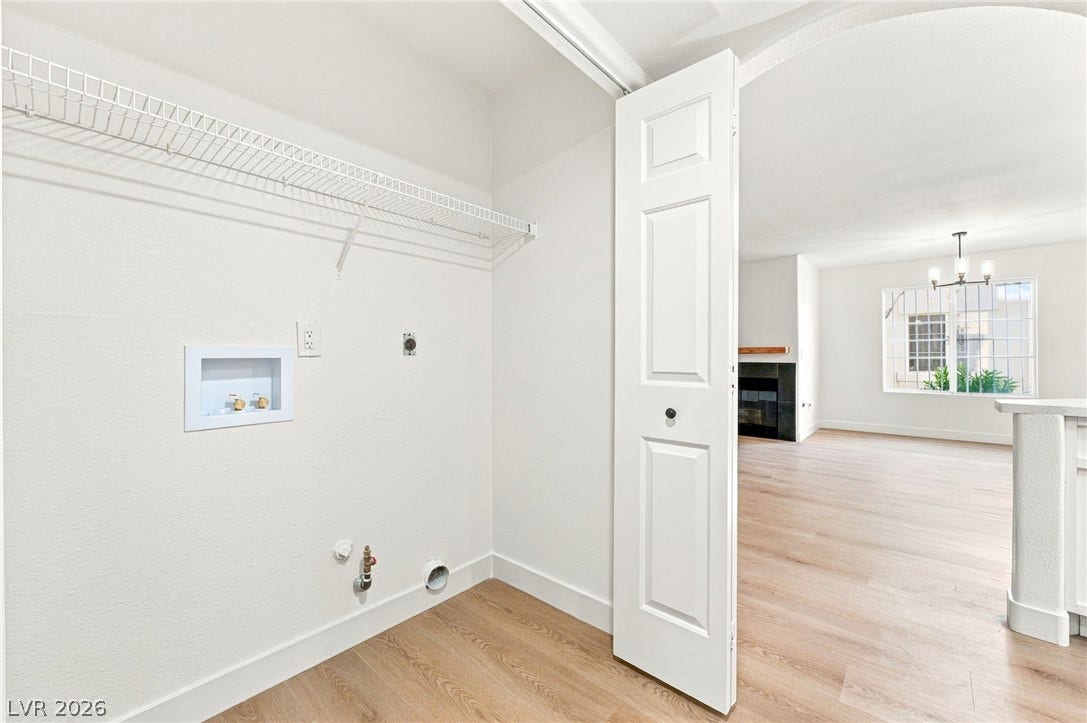 4500 W Lake Mead Boulevard, #102, Las Vegas, NV 89108 A convenient laundry closet sits just off the bright main living area featuring wood-style floors.