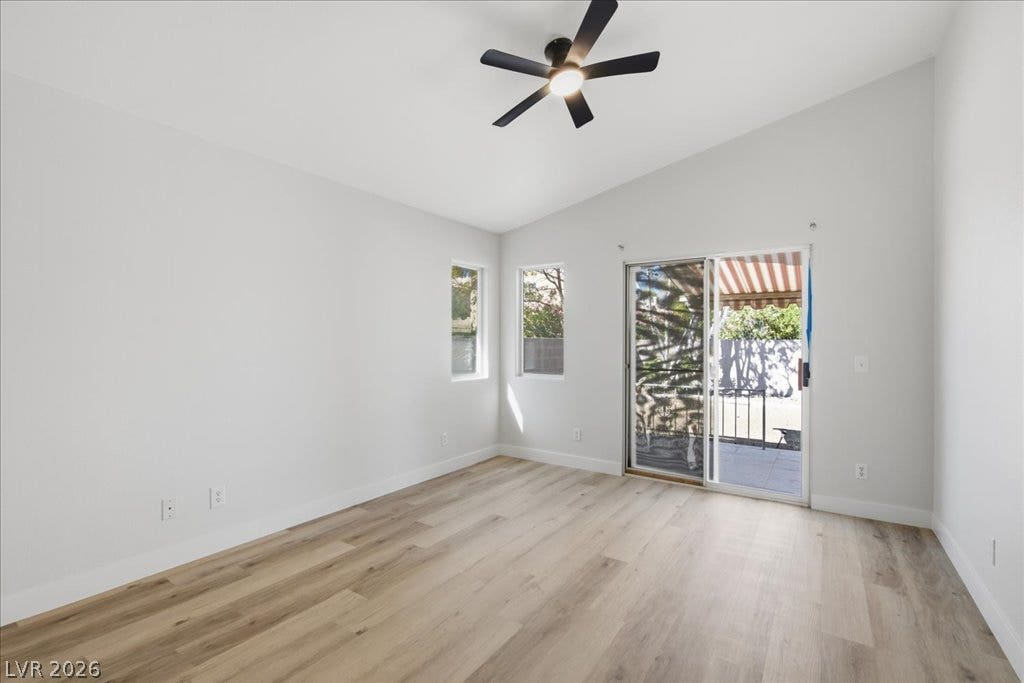 Sliding glass doors open directly to the outdoor patio from this airy room.