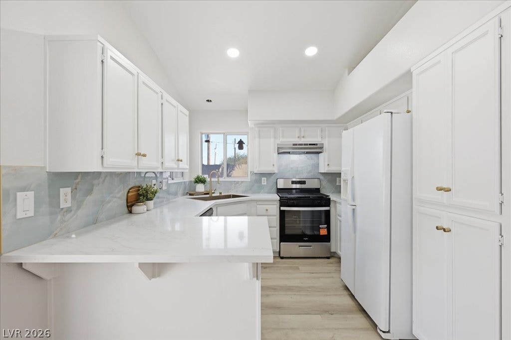Streamlined cabinetry and sleek solid-surface countertops define this efficient culinary space.