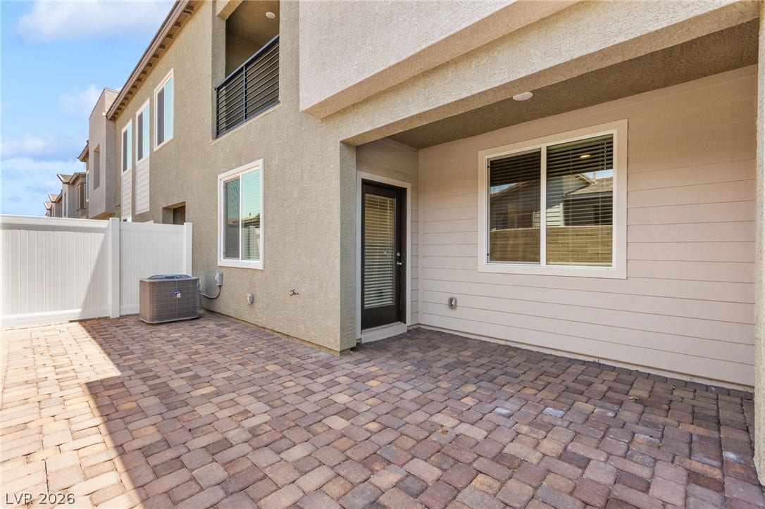 A private, paved patio space offers seamless outdoor living, ideal for relaxation or entertaining.