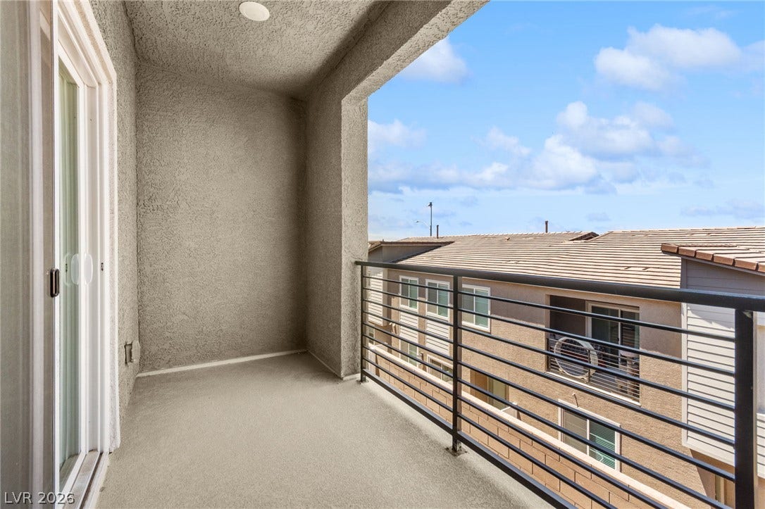 A private elevated balcony provides an outdoor retreat with sweeping views.