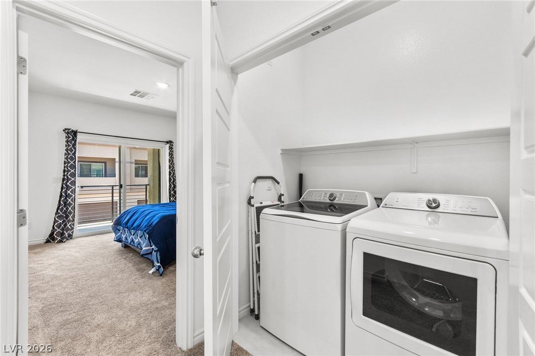 Functional laundry appliances stand ready in a dedicated space, offering convenient home maintenance.