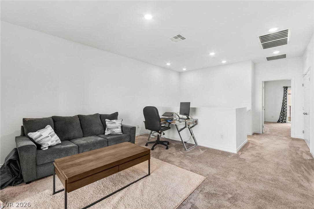Well-lit and functional, this loft offers a versatile space for relaxation and productivity.