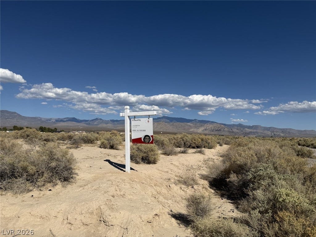 1870 Elko Street, Pahrump, NV 89048 Immense natural beauty surrounds this vast desert lot under wide blue skies.