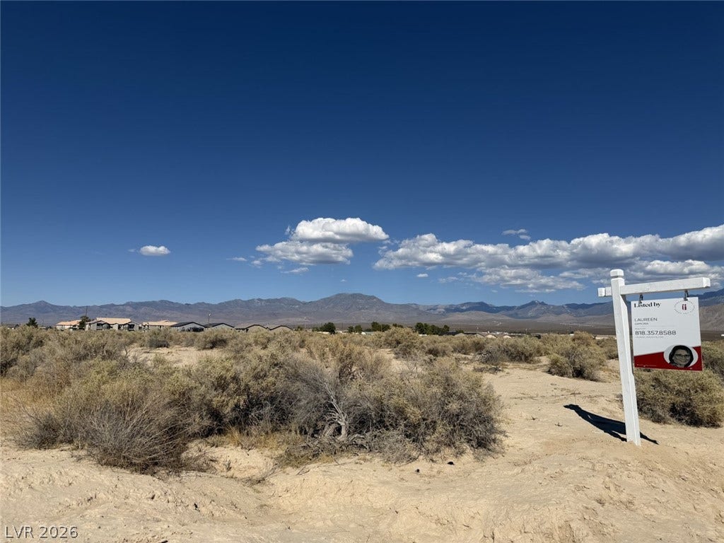1870 Elko Street, Pahrump, NV 89048 Distant mountains frame this open desert acreage under a vast blue sky.