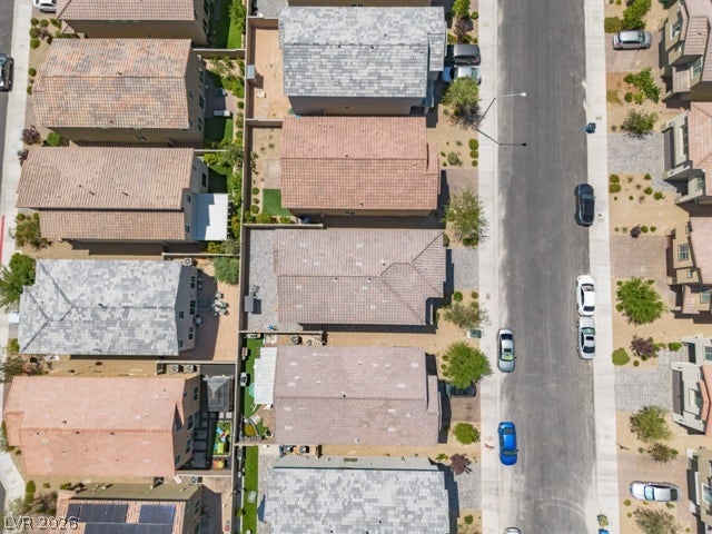 8920 Seal Cove Street, Las Vegas, NV 89178 A high-angle perspective reveals neatly arranged homes and paved roadways in a peaceful neighborhood.