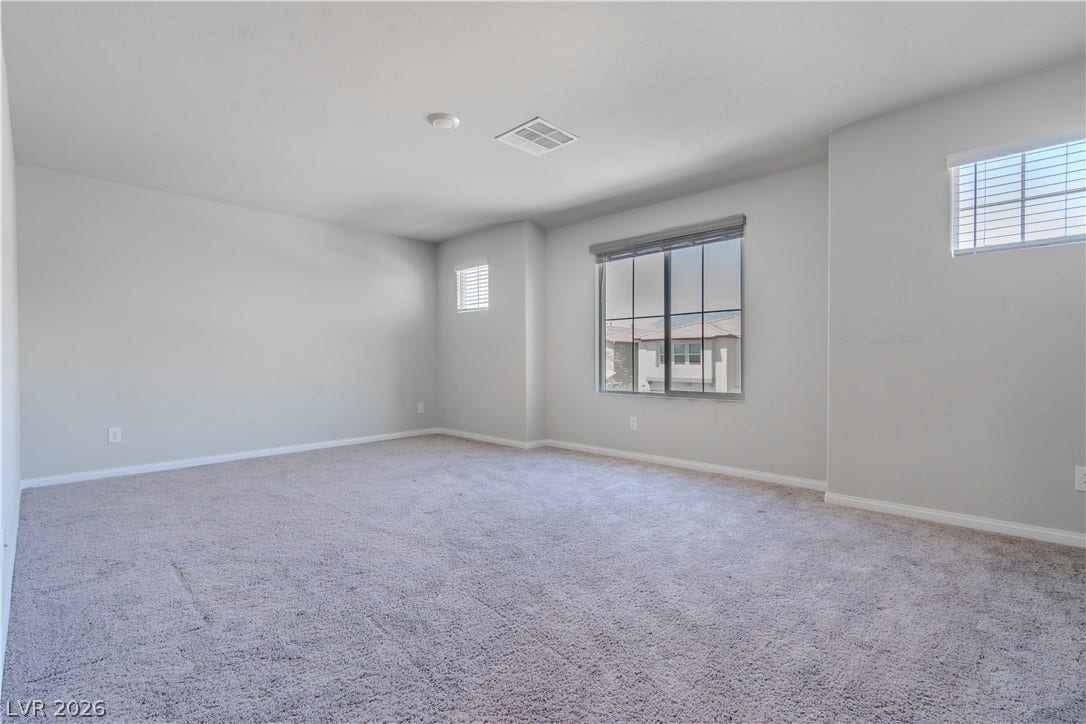 8920 Seal Cove Street, Las Vegas, NV 89178 Plush wall-to-wall carpeting and neutral tones define this versatile upper-level space.