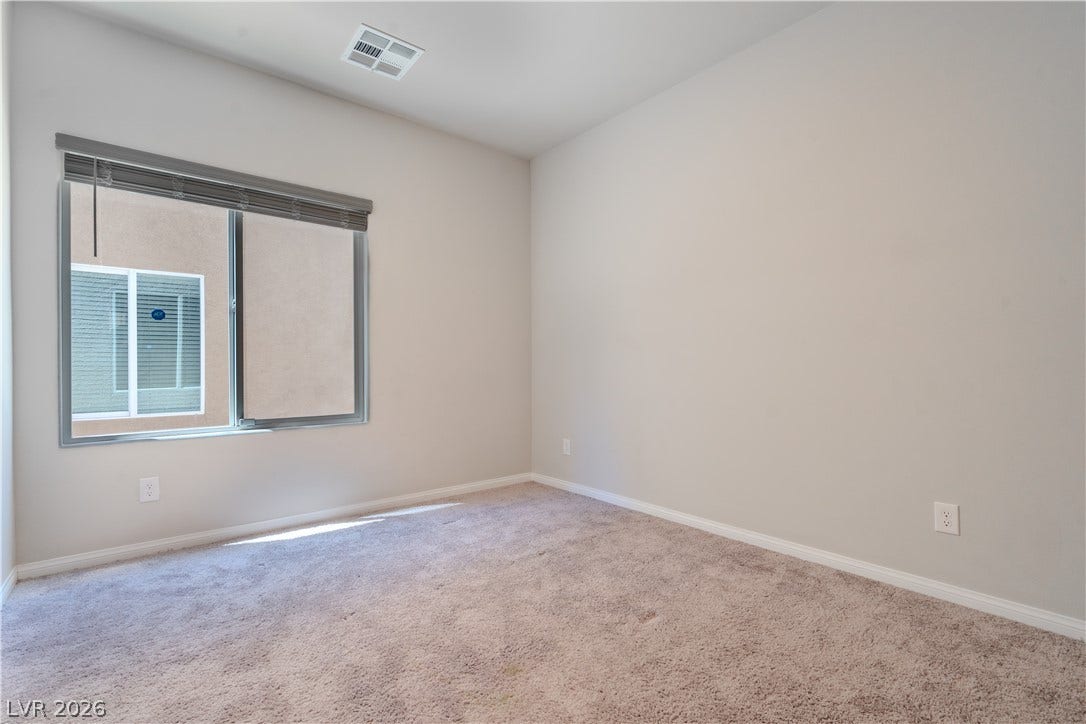 8920 Seal Cove Street, Las Vegas, NV 89178 Plush carpeting and natural light define this versatile bedroom space.