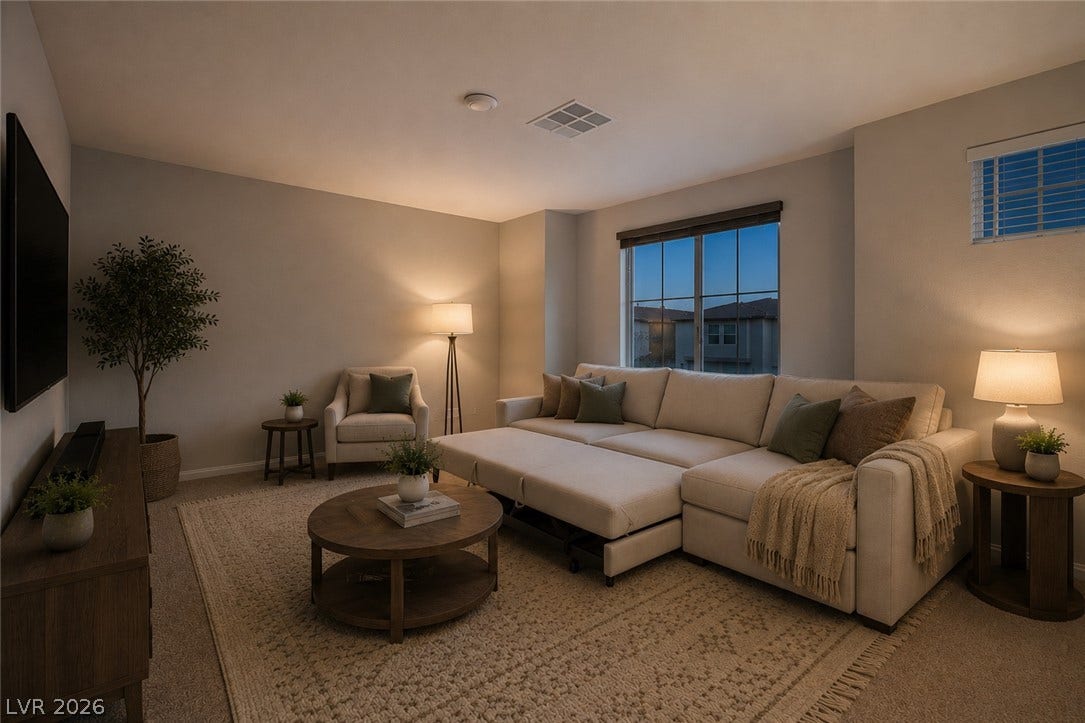 8920 Seal Cove Street, Las Vegas, NV 89178 **Virtually Staged**
A spacious secondary living area features neutral carpeting, smooth walls, and multiple dual-pane windows.