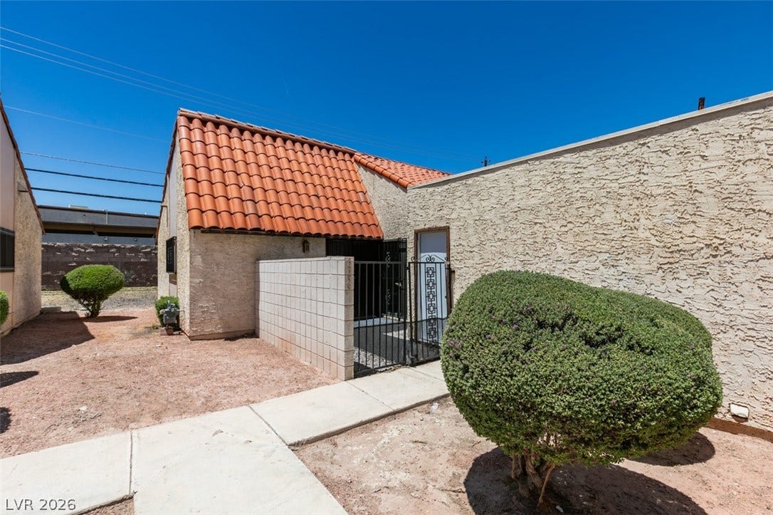 A well-maintained stucco exterior and traditional tile roof elevate this inviting residence.