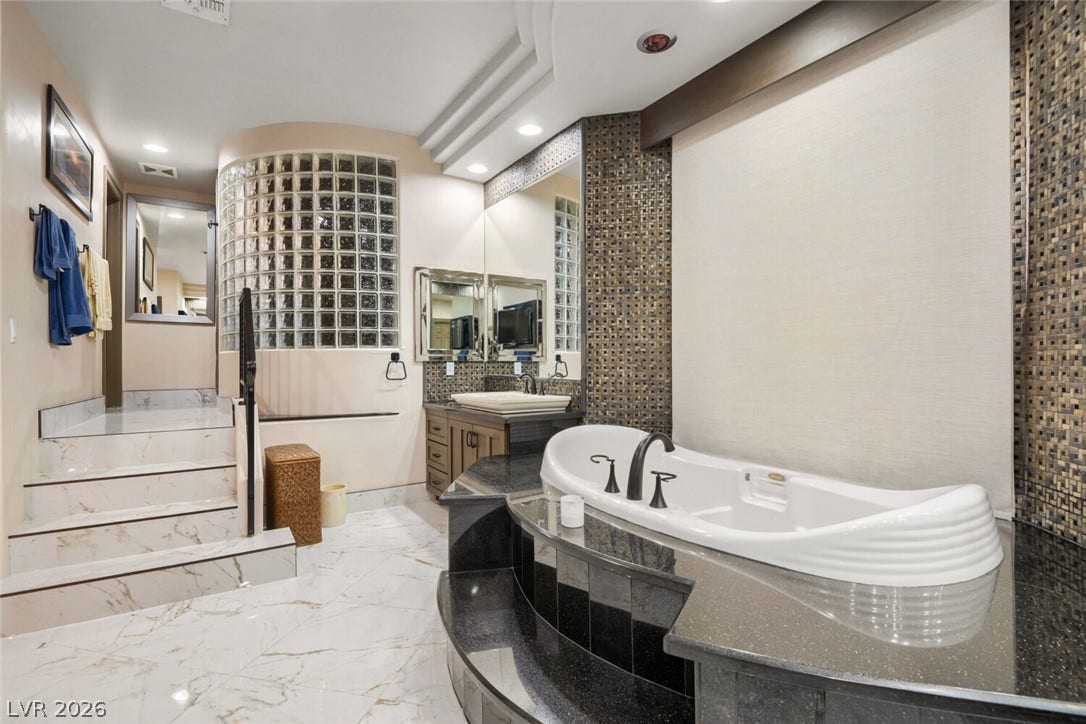 2010 Shenley Court, Las Vegas, NV 89117 Gleaming marble floors and a sunken tub create a luxurious retreat.