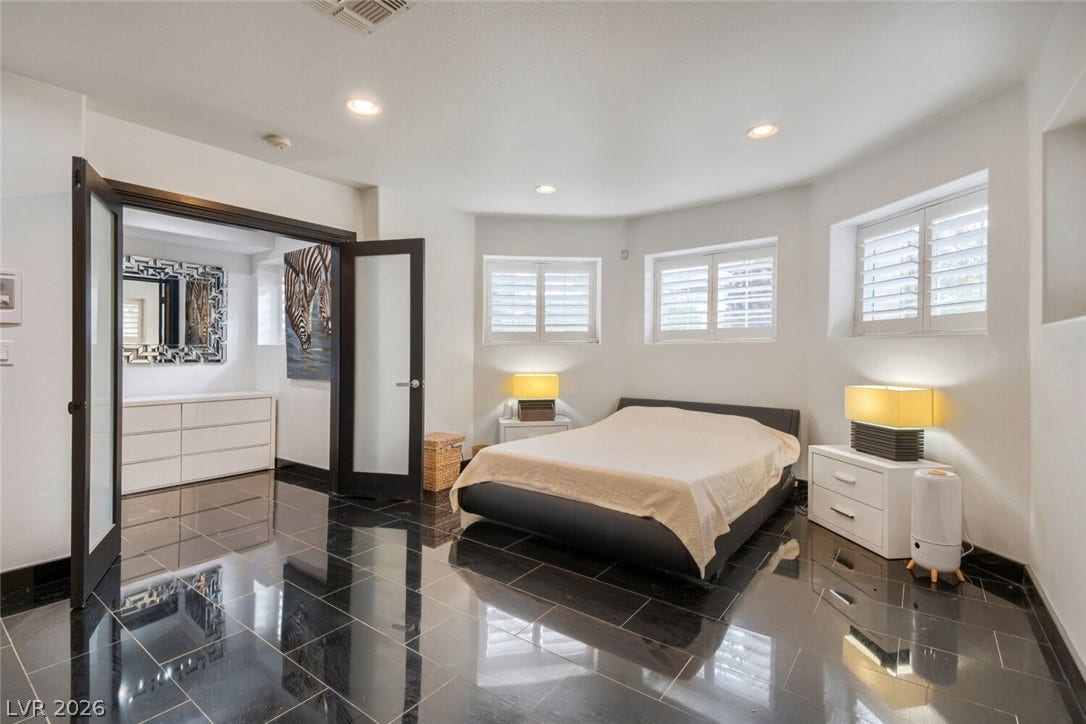 2010 Shenley Court, Las Vegas, NV 89117 Polished tile flooring and plantation shutters define this contemporary bedroom suite.
