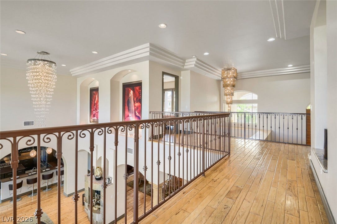 2010 Shenley Court, Las Vegas, NV 89117 Gleaming hardwood floors and classic wrought iron railings define this upper-level overlook.