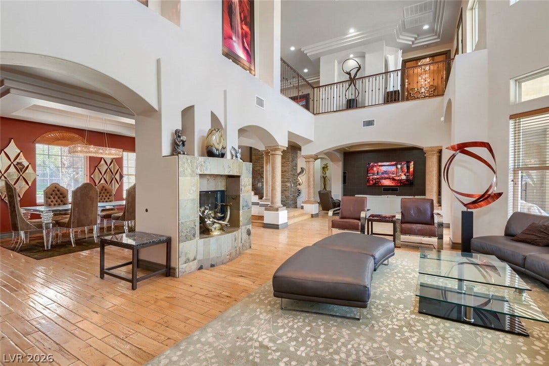 2010 Shenley Court, Las Vegas, NV 89117 Dramatic multi-level layout features arched architectural transitions and extensive hardwood flooring.