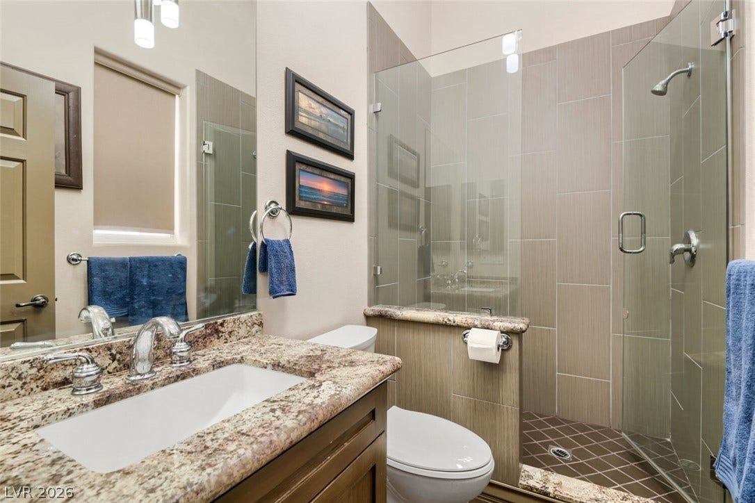 2010 Shenley Court, Las Vegas, NV 89117 Granite counters and a glass-enclosed walk-in shower elevate this bathroom.